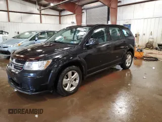 2013 Dodge Journey American Value z VIN 3C4PDCABXDT502334, wystawiony jako Copart lot #58428235 z przebiegiem 162 009 mil mil oraz Czysty tytuł • Clean title. Historia ofert i sprzedaży dostępna na DreamBid. Obrazek 1.