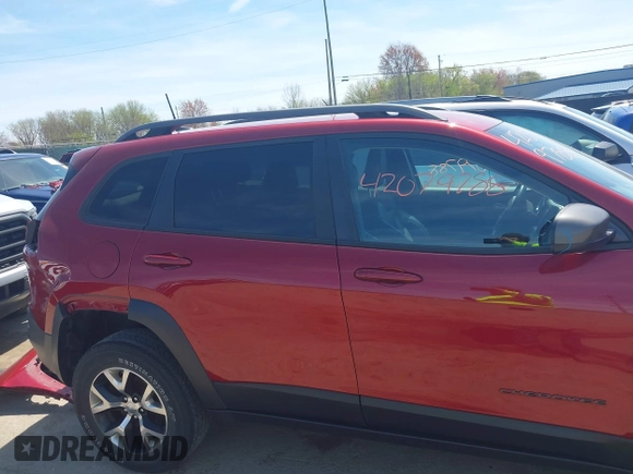 2016 Jeep Cherokee Trailhawk with VIN 1C4PJMBS9GW237059, listed as a IAAI auction lot 42079788 with 114,513 mi miles. Bid and sale history available at carsss.com. Image 14.