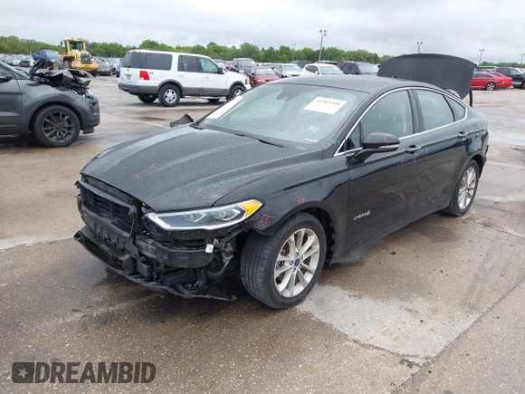 2019 Ford Fusion Hybrid SEL with VIN 3FA6P0MU1KR202860, listed as a IAAI auction lot 41983299 with 133,671 mi miles. Bid and sale history available at carsss.com. Image 2.