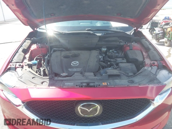 2018 Mazda CX-5 Grand Touring with VIN JM3KFBDM6J0424663, listed as a IAAI auction lot 42003207 with 95,442 mi miles and . Bid and sale history available at DreamBid. Image 10.