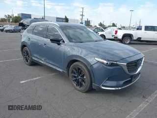 2021 Mazda CX-9 Grand Touring with VIN JM3TCADY1M0519288, listed as a IAAI auction lot 41186094 with 50,701 mi miles and . Bid and sale history available at DreamBid. Image 1.