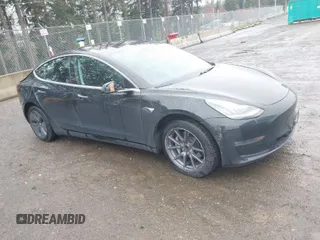2019 Tesla Model 3 Mid Range with VIN 5YJ3E1EAXKF296378, listed as a IAAI auction lot 41739616 with 77,100 mi miles. Bid and sale history available at carsss.com. Image 1.