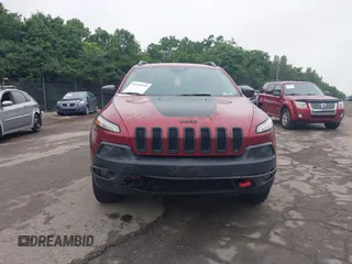 2015 Jeep Cherokee Trailhawk with VIN 1C4PJMBSXFW667469, listed as a IAAI auction lot 42438006 with 127,136 mi miles and . Bid and sale history available at DreamBid. Image 13.
