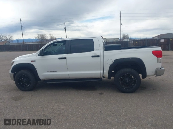 2012 Toyota Tundra 4WD Truck with VIN 5TFDW5F10CX223471, listed as a IAAI auction lot 41839687 with 249,246 mi miles. Bid and sale history available at carsss.com. Image 14.