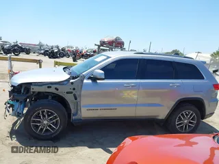 2018 Jeep Grand Cherokee Laredo E with VIN 1C4RJEAG2JC429850, listed as a IAAI auction lot 42541574 with 72,009 mi miles and . Bid and sale history available at DreamBid. Image 15.