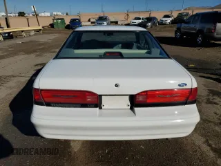 1994 Ford Thunderbird LX with VIN 1FALP62WXRH217279, listed as a Copart auction lot 80512504 with 176,798 mi miles and Salvage Title. Bid and sale history available at DreamBid. Image 6.