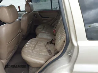 1999 Jeep Grand Cherokee Limited with VIN 1J4GW68SXXC664055, listed as a IAAI auction lot 42339125 with 219,792 mi miles and . Bid and sale history available at DreamBid. Image 8.