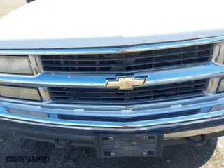 1999 Chevrolet Suburban with VIN 3GNFK16R4XG227995, listed as a IAAI auction lot 42034142 with 241,792 mi miles. Bid and sale history available at carsss.com. Image 6.