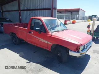 1992 Toyota Pickup DLX z VIN JT4RN82P8N5056666, wystawiony jako IAAI lot #42320829 z przebiegiem 147 032 mil mil oraz . Historia ofert i sprzedaży dostępna na DreamBid. Obrazek 1.