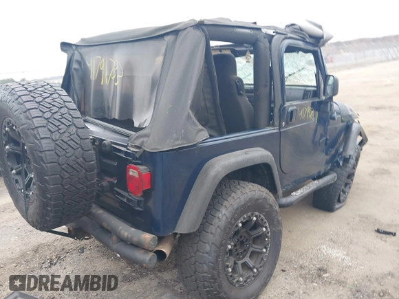 2003 Jeep Wrangler X with VIN 1J4FA39S23P300447, listed as a IAAI auction lot 41791733 with 165,576 mi miles. Bid and sale history available at carsss.com. Image 4.