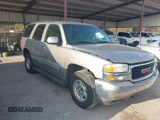 2003 GMC Yukon SLT with VIN 1GKEC13Z43R163266, listed as a IAAI auction lot 41540592 with 173,804 mi miles. Bid and sale history available at carsss.com. Image 1.