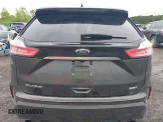 2020 Ford Edge SE z VIN 2FMPK4G94LBB18927, wystawiony jako IAAI lot #42332042 z przebiegiem 86 720 mil mil oraz . Historia ofert i sprzedaży dostępna na DreamBid. Obrazek 17.