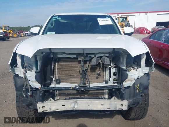 2023 Toyota Tacoma SR with VIN 3TYCZ5AN2PT112854, listed as a IAAI auction lot 42220025 with 43,657 mi miles and . Bid and sale history available at DreamBid. Image 13.