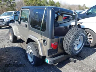 2004 Jeep Wrangler Sahara with VIN 1J4FA59S14P772264, listed as a IAAI auction lot 41814074 with 165,750 mi miles and . Bid and sale history available at DreamBid. Image 3.