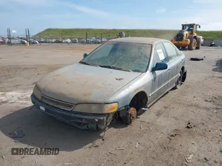 1996 Honda Accord EX w/Leather with VIN 1HGCD5666TA055580, listed as a IAAI auction lot 42021014 with 300,191 mi miles. Bid and sale history available at carsss.com. Image 6.