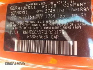 2012 Hyundai Veloster w/Gray Int z VIN KMHTC6AD7CU030176, wystawiony jako IAAI lot #36994035 z przebiegiem Nie podano mil oraz . Historia ofert i sprzedaży dostępna na DreamBid. Obrazek 9.