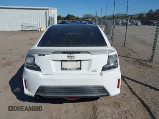 2014 Scion tC z VIN JTKJF5C74E3072410, wystawiony jako IAAI lot #41810965 z przebiegiem 147 164 mil mil oraz . Historia ofert i sprzedaży dostępna na DreamBid. Obrazek 17.