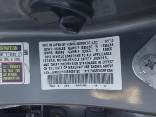 2011 Honda Insight EX with VIN JHMZE2H76BS004162, listed as a IAAI auction lot 41333373 with 287,593 mi miles. Bid and sale history available at carsss.com. Image 9.