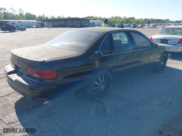 1996 Chevrolet Caprice Classic 1SA Special Value Pkg with VIN 1G1BL52PXTR141223, listed as a IAAI auction lot 41693524 with 1 mi miles. Bid and sale history available at carsss.com. Image 4.
