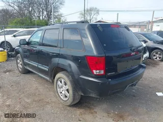 2009 Jeep Grand Cherokee Laredo with VIN 1J8GS48K59C548330, listed as a IAAI auction lot 41887548 with 184,434 mi miles. Bid and sale history available at carsss.com. Image 3.