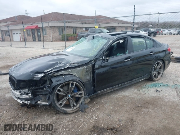 2018 BMW 5 Series M550i xDrive with VIN WBAJB9C56JB286742, listed as a IAAI auction lot 42176643 with 61,445 mi miles and . Bid and sale history available at DreamBid. Image 2.