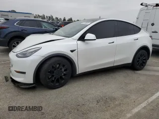 2021 Tesla Model Y Long Range with VIN 5YJYGDEE3MF214823, listed as a Copart auction lot 50738045 with 63,227 mi miles and Salvage Title. Bid and sale history available at DreamBid. Image 1.