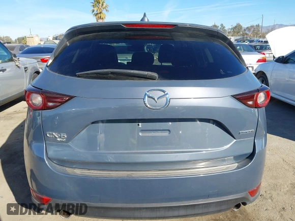 2021 Mazda CX-5 Touring with VIN JM3KFBCM9M0434433, listed as a IAAI auction lot 41425112 with 57,527 mi miles. Bid and sale history available at carsss.com. Image 17.