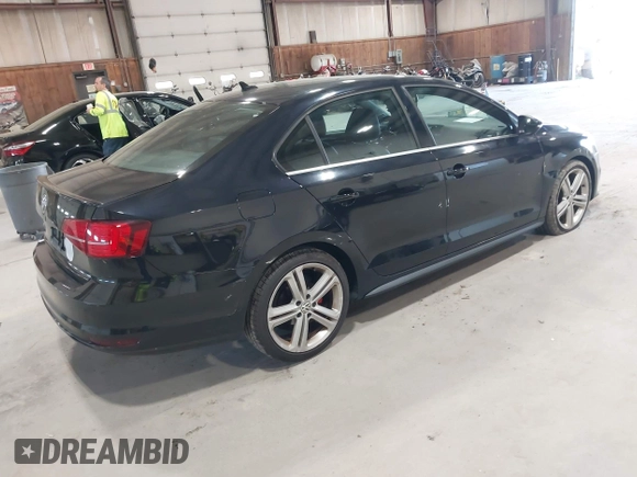 2015 Volkswagen Jetta Sedan 2.0T GLI SE with VIN 3VW5T7AJ0FM275867, listed as a IAAI auction lot 42133491 with 98,718 mi miles. Bid and sale history available at carsss.com. Image 4.