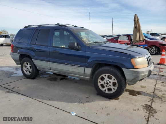 1999 Jeep Grand Cherokee Laredo with VIN 1J4GW58S0XC653687, listed as a Copart auction lot 81166844 with 252,330 mi miles and Salvage Title. Bid and sale history available at carsss.com. Image 4.
