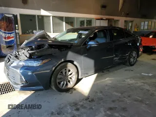2020 Toyota Avalon Hybrid XLE z VIN 4T1A21FB7LU014807, wystawiony jako Copart lot #38368943 z przebiegiem 40 015 mil mil oraz . Historia ofert i sprzedaży dostępna na DreamBid. Obrazek 1.