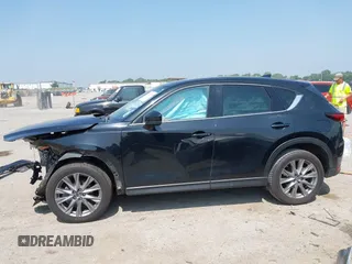 2020 Mazda CX-5 Grand Touring with VIN JM3KFADM1L0781634, listed as a IAAI auction lot 42333769 with 103,080 mi miles and . Bid and sale history available at DreamBid. Image 14.