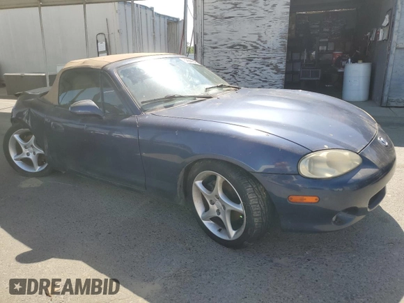 2002 Mazda MX-5 Miata Cloth z VIN JM1NB353220222868, wystawiony jako Copart lot #59944345 z przebiegiem 159 595 mil mil oraz Szkoda całkowita • Salvage title. Historia ofert i sprzedaży dostępna na DreamBid. Obrazek 4.