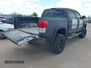 2013 Toyota Tundra 4WD Truck with VIN 5TFDW5F14DX279527, listed as a IAAI auction lot 41594899 with 212,973 mi miles. Bid and sale history available at carsss.com. Image 4.