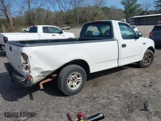 1999 Ford F-150 Work Series with VIN 1FTZF1726XNB58407, listed as a IAAI auction lot 41753826 with 180,172 mi miles. Bid and sale history available at carsss.com. Image 4.