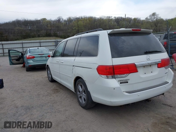 2010 Honda Odyssey Touring with VIN 5FNRL3H99AB005395, listed as a IAAI auction lot 42027445 with 181,559 mi miles. Bid and sale history available at carsss.com. Image 3.