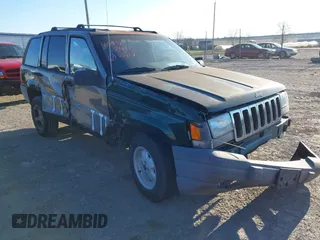 1997 Jeep Grand Cherokee Laredo with VIN 1J4GZ58SXVC687950, listed as a IAAI auction lot 40978411 with 176,514 mi miles. Bid and sale history available at carsss.com. Image 1.