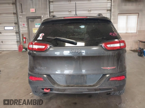 2016 Jeep Cherokee Trailhawk with VIN 1C4PJMBS2GW309042, listed as a IAAI auction lot 41564925 with 125,436 mi miles. Bid and sale history available at carsss.com. Image 17.