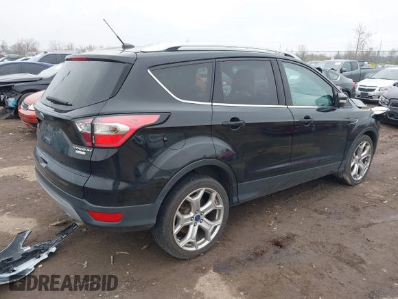 2017 Ford Escape Titanium with VIN 1FMCU0J95HUD37858, listed as a IAAI auction lot 41984629 with 87,163 mi miles and . Bid and sale history available at DreamBid. Image 4.