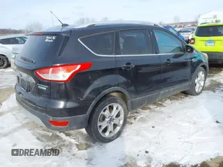 2015 Ford Escape Titanium with VIN 1FMCU0J90FUA32720, listed as a IAAI auction lot 41594336 with 180,250 mi miles. Bid and sale history available at carsss.com. Image 4.