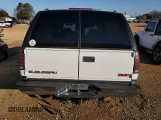 1999 GMC Suburban with VIN 3GKEC16R4XG545069, listed as a Copart auction lot 88541575 with 195,829 mi miles and Salvage Title. Bid and sale history available at carsss.com. Image 6.