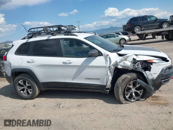 2017 Jeep Cherokee Trailhawk L Plus z VIN 1C4PJMBS9HD238905, wystawiony jako IAAI lot #42381268 z przebiegiem 130 535 mil mil oraz . Historia ofert i sprzedaży dostępna na DreamBid. Obrazek 14.
