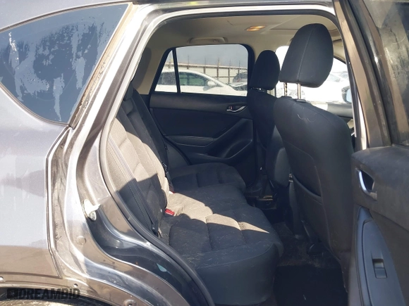 2016 Mazda CX-5 Touring with VIN JM3KE4CY3G0672977, listed as a IAAI auction lot 41889137 with 130,593 mi miles. Bid and sale history available at carsss.com. Image 8.