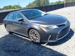2016 Toyota Avalon Limited with VIN 4T1BK1EB4GU208979, listed as a IAAI auction lot 42032374 with 242,738 mi miles. Bid and sale history available at carsss.com. Image 1.