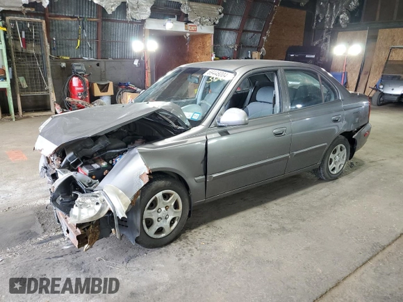 2005 Hyundai Accent GLS with VIN KMHCG45C95U632932, listed as a Copart auction lot 69448004 with 0 mi miles and Salvage Title. Bid and sale history available at carsss.com. Image 1.