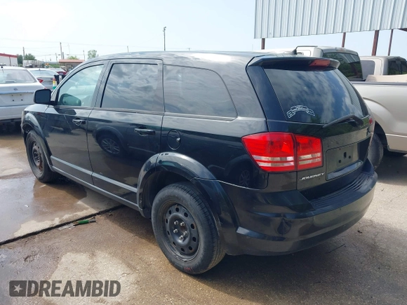 2014 Dodge Journey SE with VIN 3C4PDCABXET235827, listed as a IAAI auction lot 41927966 with 186,179 mi miles and . Bid and sale history available at carsss.com. Image 3.