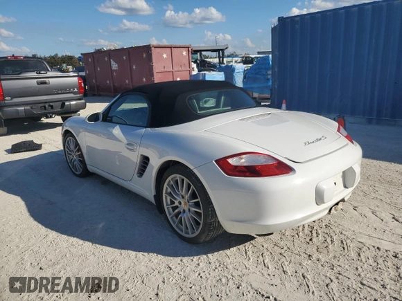 2007 Porsche Boxster S z VIN WP0CB29837U730970, wystawiony jako Copart lot #77829184 z przebiegiem Nie podano mil oraz Szkoda całkowita • Salvage title. Historia ofert i sprzedaży dostępna na DreamBid. Obrazek 2.
