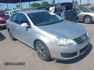 2009 Volkswagen Jetta S z VIN 3VWJZ71K19M052778, wystawiony jako IAAI lot #41968579 z przebiegiem 202 744 mil mil oraz . Historia ofert i sprzedaży dostępna na DreamBid. Obrazek 1.