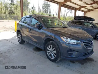 2016 Mazda CX-5 Sport with VIN JM3KE4BY1G0910102, listed as a IAAI auction lot 42115163 with 144,495 mi miles and . Bid and sale history available at carsss.com. Image 1.
