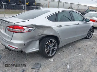 2019 Ford Fusion Titanium with VIN 3FA6P0K96KR120749, listed as a IAAI auction lot 40737085 with 118,376 mi miles and . Bid and sale history available at DreamBid. Image 4.