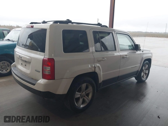 2014 Jeep Patriot Latitude with VIN 1C4NJPFA3ED618523, listed as a IAAI auction lot 41108657 with 124,035 mi miles and . Bid and sale history available at carsss.com. Image 4.